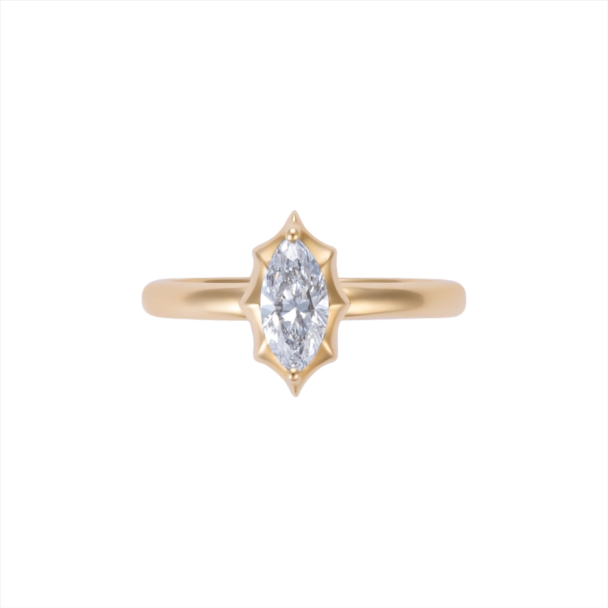 Modern deco-inspired 14K yellow gold ring featuring a sleek 0.56ct G-H VS marquise-cut diamond in a striking starburst design, offering a unique and refined statement silhouette.