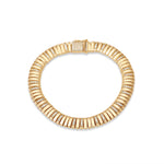Elegant 14K Italian yellow gold ribbed slinky bracelet featuring shimmering diamond accents, offering a sleek, flexible design that combines comfort and sophistication.