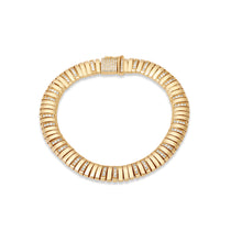 Elegant 14K Italian yellow gold ribbed slinky bracelet featuring shimmering diamond accents, offering a sleek, flexible design that combines comfort and sophistication.