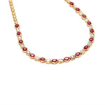 Timeless 14K yellow gold bead necklace featuring a perfect combination of natural rubies and sparkling diamonds, with an adjustable design for versatile elegance, ideal for any special occasion. Close up of Diamonds and Rubys.