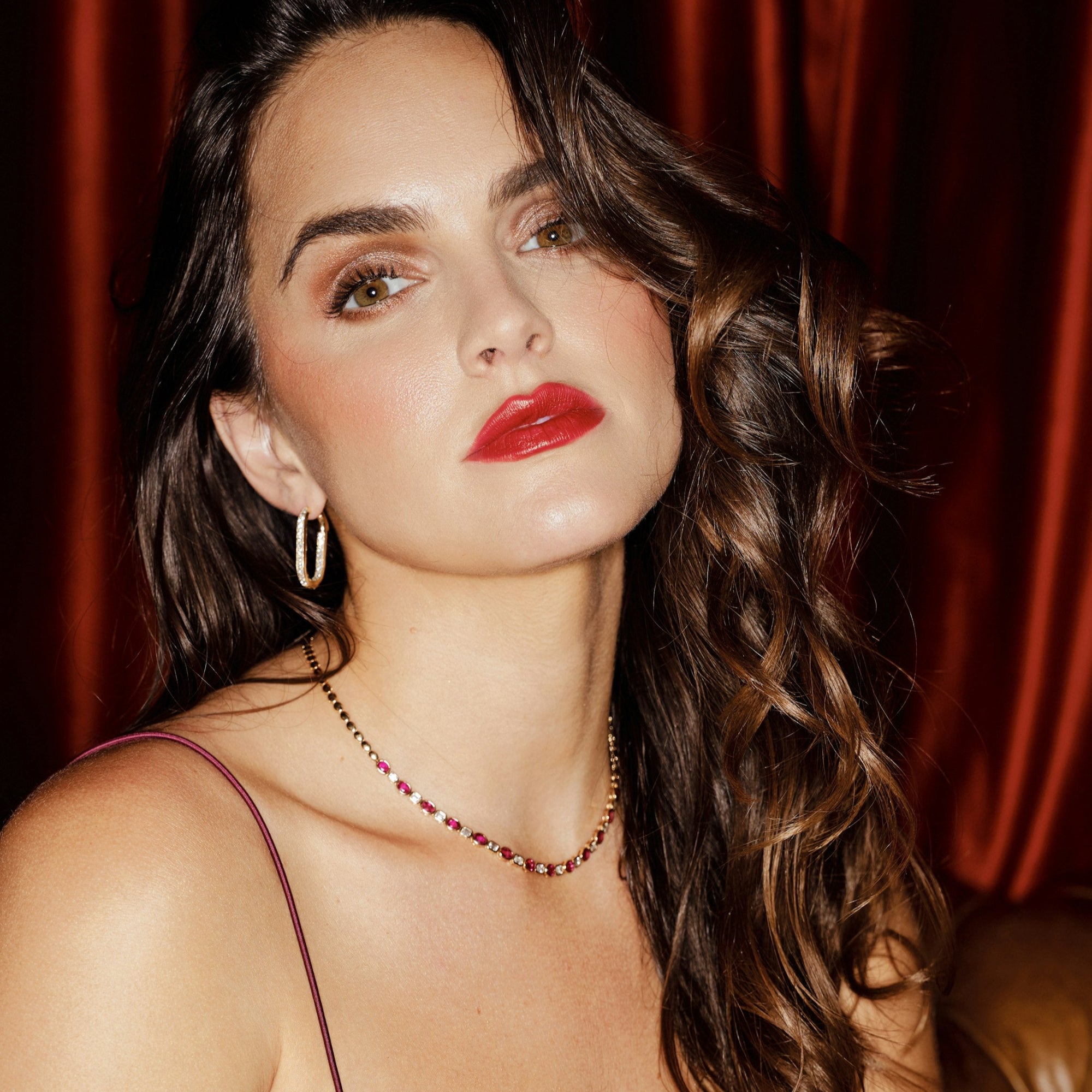 Timeless 14K yellow gold bead necklace featuring a perfect combination of natural rubies and sparkling diamonds, with an adjustable design for versatile elegance, ideal for any special occasion. On Model. 