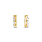 Sleek 14K yellow gold hinged huggie hoop earrings featuring four radiant pear-shaped diamonds arranged side by side, offering a blend of minimalism, brilliance, and timeless sophistication. Close up front view. 