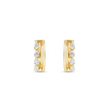 Sleek 14K yellow gold hinged huggie hoop earrings featuring four radiant pear-shaped diamonds arranged side by side, offering a blend of minimalism, brilliance, and timeless sophistication. Close up front view. 