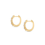 Sleek 14K yellow gold hinged huggie hoop earrings featuring four radiant pear-shaped diamonds arranged side by side, offering a blend of minimalism, brilliance, and timeless sophistication. Close up side view. 
