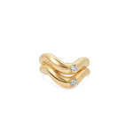 Stylish stackable wave ring crafted in 14K gold, featuring a sleek design that gracefully cradles a dazzling round-cut diamond accent, perfect for layering or wearing alone. Stacked