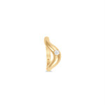 Stylish stackable wave ring crafted in 14K gold, featuring a sleek design that gracefully cradles a dazzling round-cut diamond accent, perfect for layering or wearing alone. Side. 