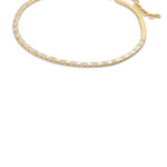 Striking 14K yellow gold checkered necklace featuring alternating square gold beads and pavé diamond links, offering a bold yet elegant statement with an adjustable fit. Side view, close up. 
