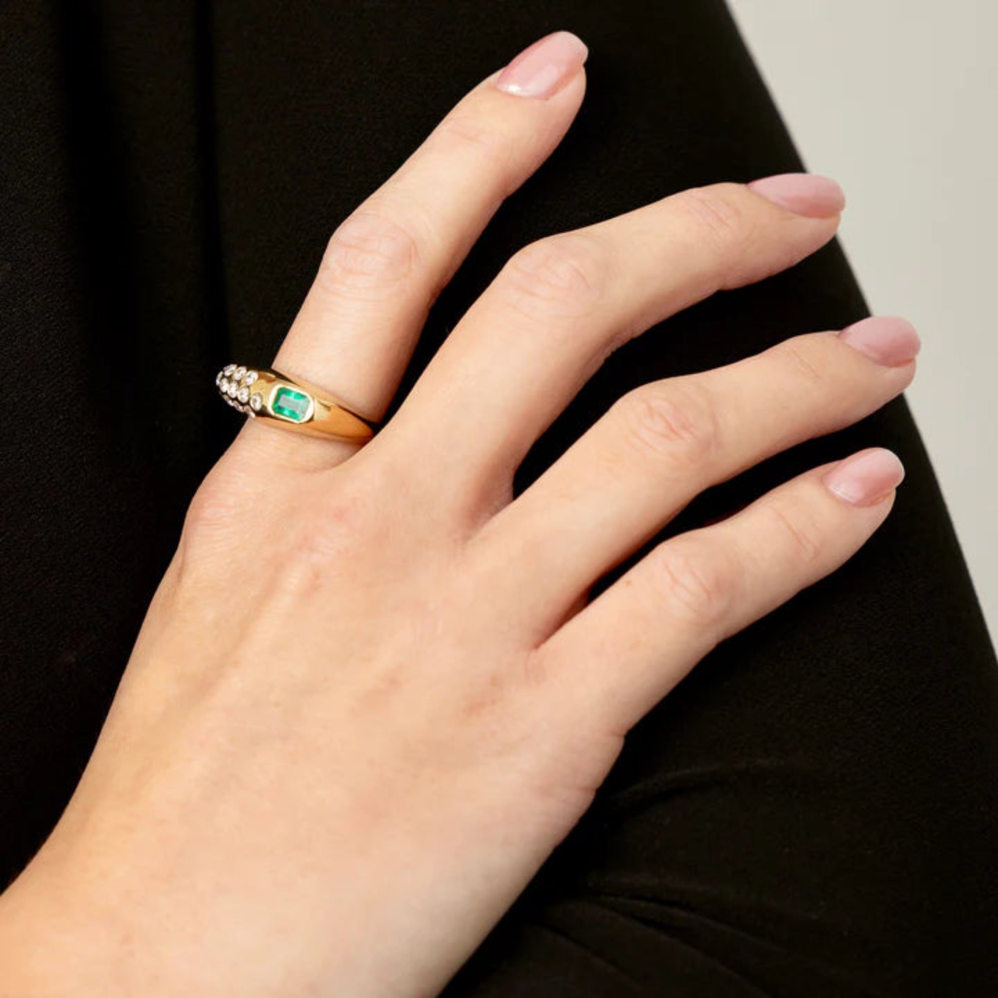 Chunky 14K yellow gold ring featuring a 0.53ct east-west emerald accented with 0.22ct of G-H VS diamonds in an asymmetrical, modern design—perfect for a bold yet refined statement.