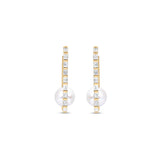 Stunning elongated hoop earrings featuring a sleek rectangular design adorned with diamond baguettes along the outside and a beautiful pearl solitaire at the bottom, crafted in 14K gold for a sophisticated statement. Front view. 