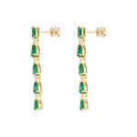 Elegant 14K yellow gold drop earrings featuring a linear arrangement of vivid pear-shaped emeralds totaling 3.52ct, each linked with a prong-set diamond (0.29ct), for a graceful and radiant look.