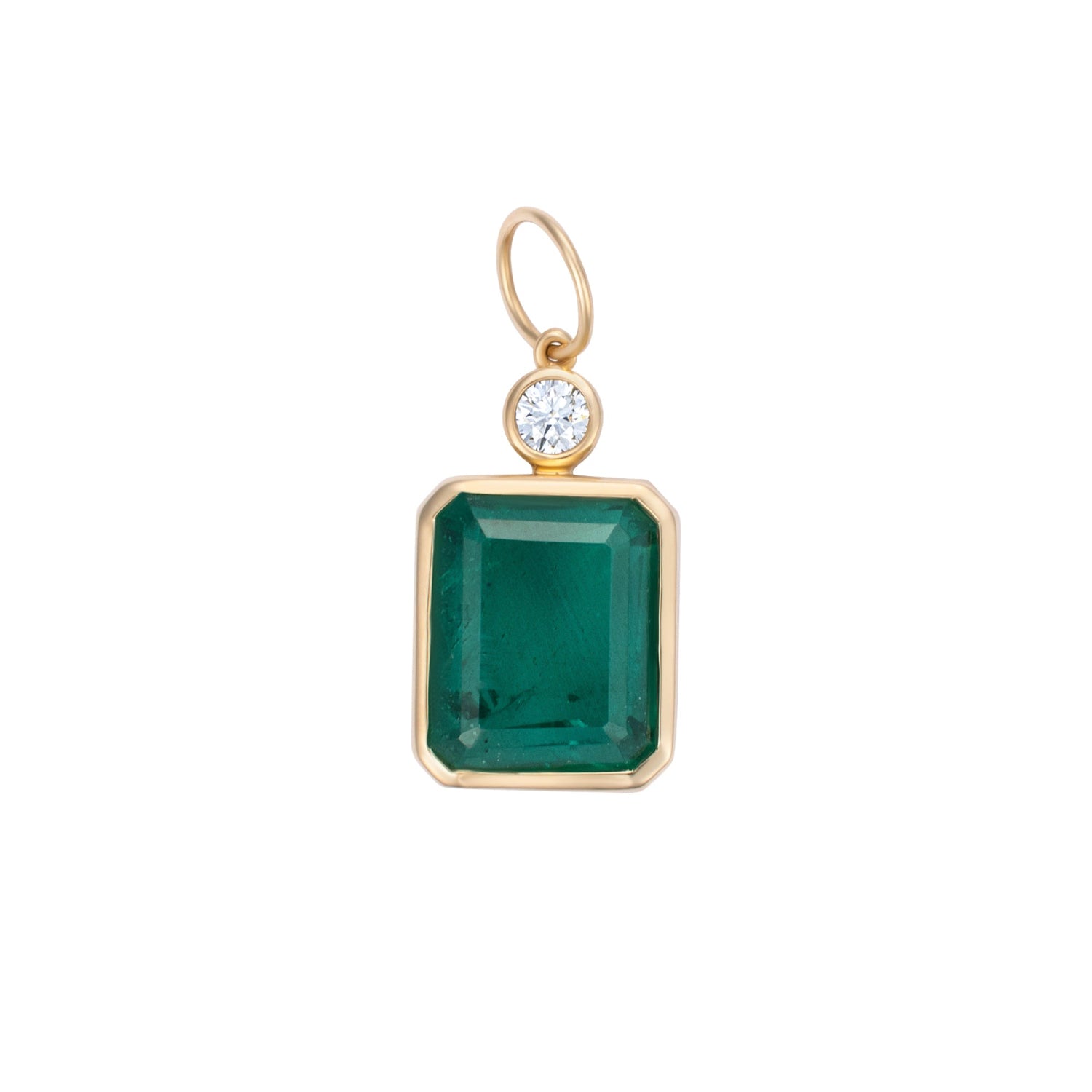 Elegant pendant featuring a large emerald-cut Colombian emerald paired with a diamond accent, framed in 14K yellow gold, showcasing timeless design and exceptional craftsmanship.