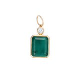 Elegant pendant featuring a large emerald-cut Colombian emerald paired with a diamond accent, framed in 14K yellow gold, showcasing timeless design and exceptional craftsmanship.