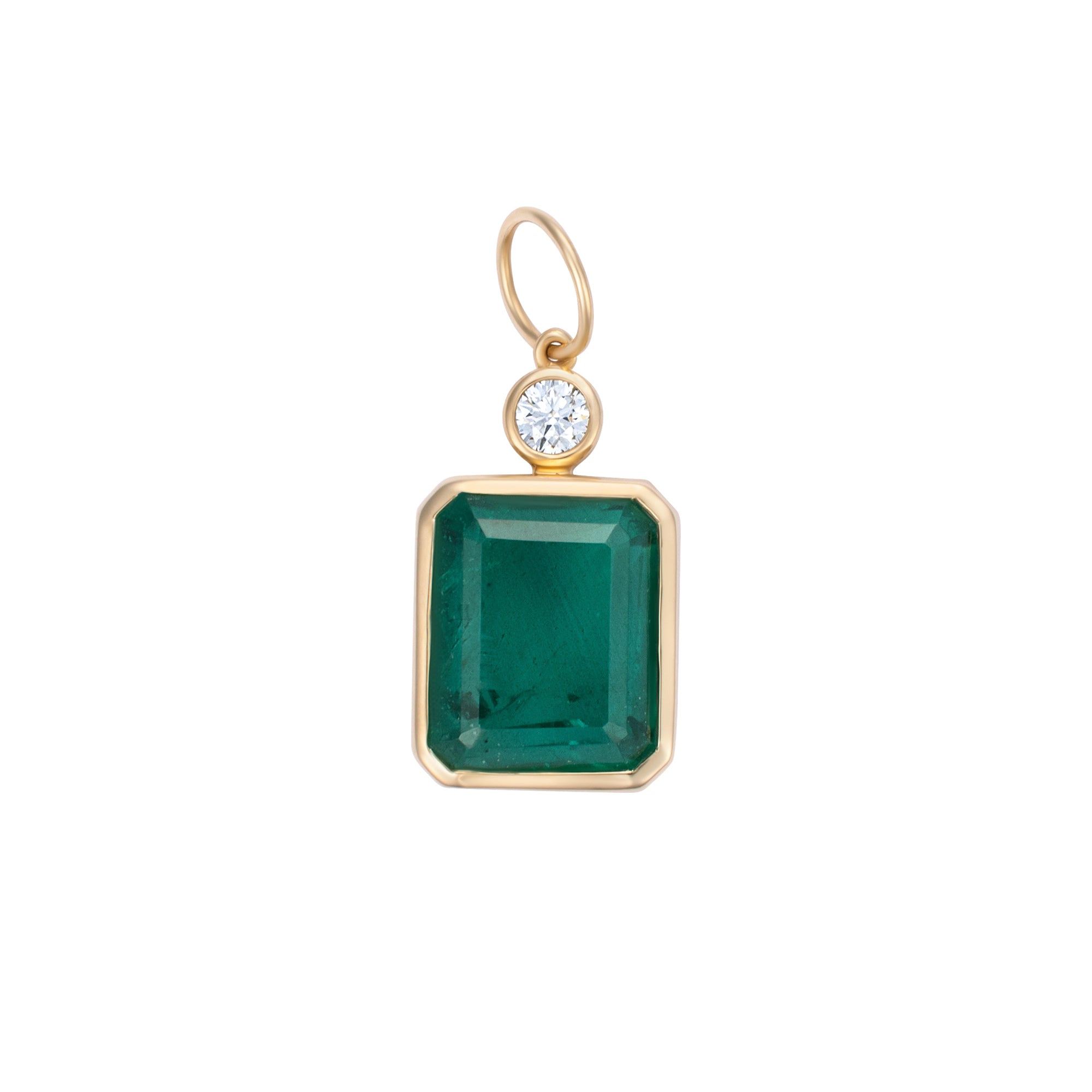 Elegant pendant featuring a large emerald-cut Colombian emerald paired with a diamond accent, framed in 14K yellow gold, showcasing timeless design and exceptional craftsmanship.