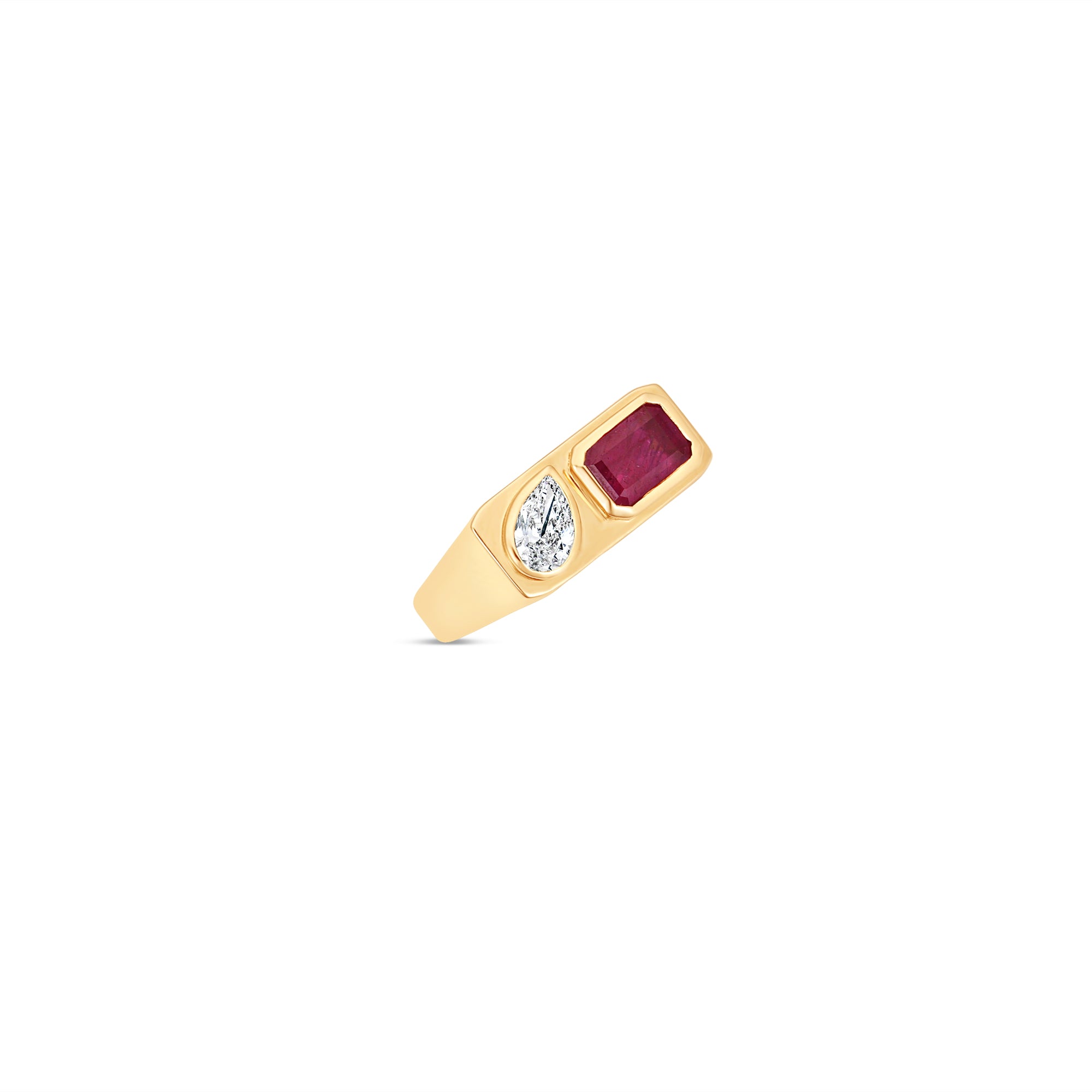 Striking east-west ring crafted in 14K yellow gold, featuring a bezel-set emerald-cut ruby and a sparkling pear-shaped diamond, exuding sophistication and timeless charm as a bold statement piece. Tilted 