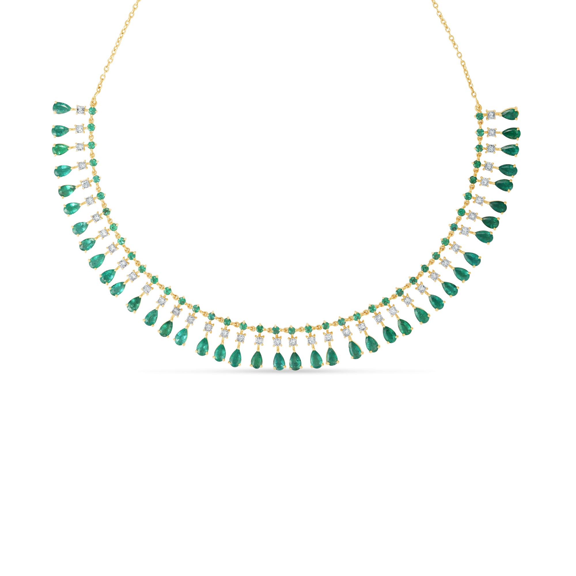 Captivating bib necklace crafted in 14K yellow gold, featuring vibrant emeralds and sparkling diamonds delicately arranged on an adjustable chain for timeless elegance and versatility. Close Up. 