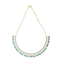 Captivating bib necklace crafted in 14K yellow gold, featuring vibrant emeralds and sparkling diamonds delicately arranged on an adjustable chain for timeless elegance and versatility.