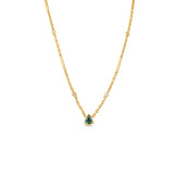 Stunning 14K yellow gold convertible lariat necklace featuring radiant pear-shaped emeralds and dazzling diamonds, designed to be worn as a statement lariat or separated into a matching necklace and bracelet set for versatile elegance. Close up of necklace. 
