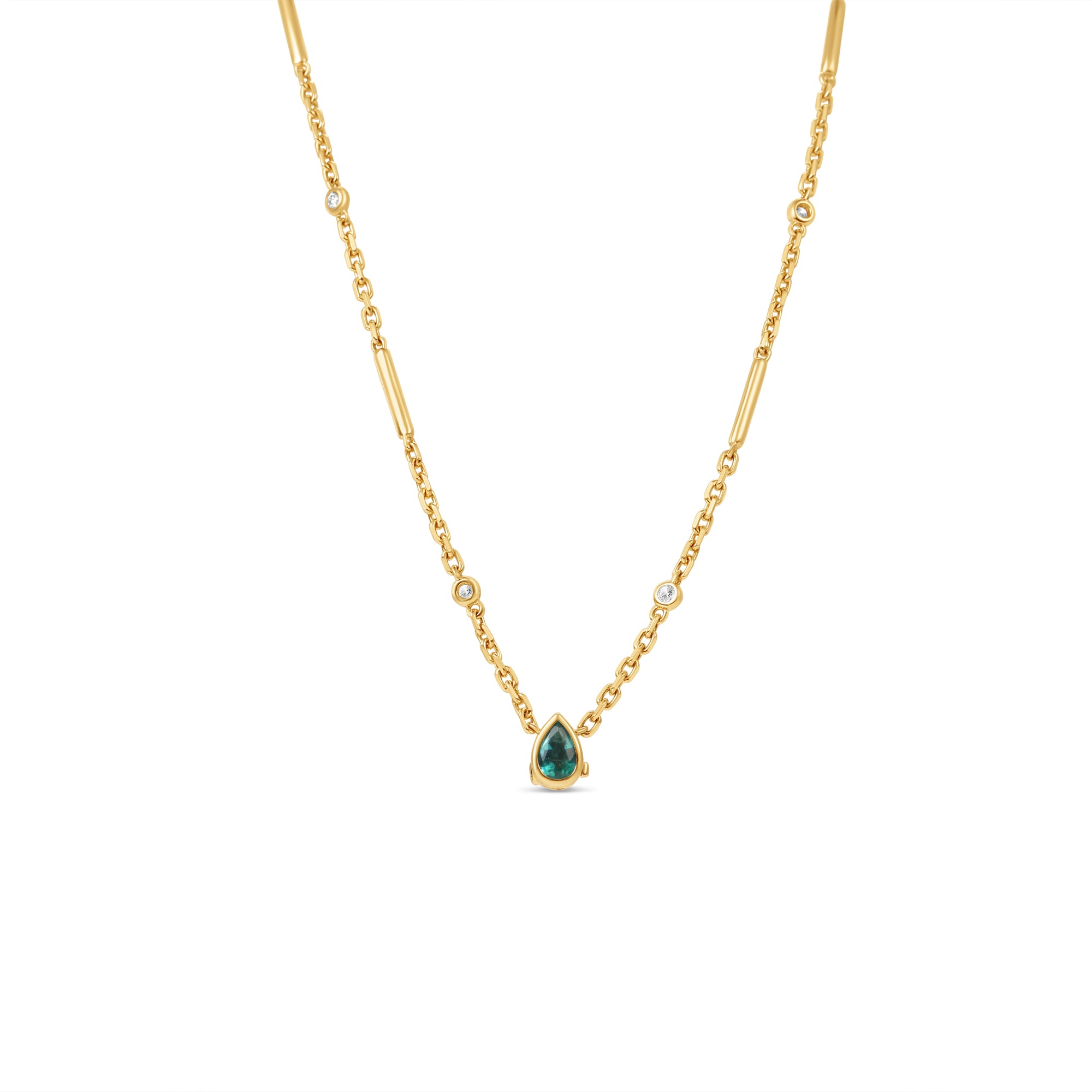 Stunning 14K yellow gold convertible lariat necklace featuring radiant pear-shaped emeralds and dazzling diamonds, designed to be worn as a statement lariat or separated into a matching necklace and bracelet set for versatile elegance. Close up of necklace. 