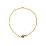 Stunning 14K yellow gold convertible lariat necklace featuring radiant pear-shaped emeralds and dazzling diamonds, designed to be worn as a statement lariat or separated into a matching necklace and bracelet set for versatile elegance. Close up of bracelet. 