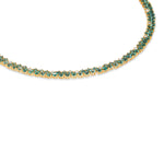 Mesmerizing dual tennis necklace crafted in 14K yellow gold, featuring vivid emeralds and sparkling diamond accents, offering a sophisticated and timeless design for elevating any ensemble.