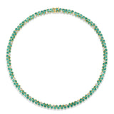 Mesmerizing dual tennis necklace crafted in 14K yellow gold, featuring vivid emeralds and sparkling diamond accents, offering a sophisticated and timeless design for elevating any ensemble.