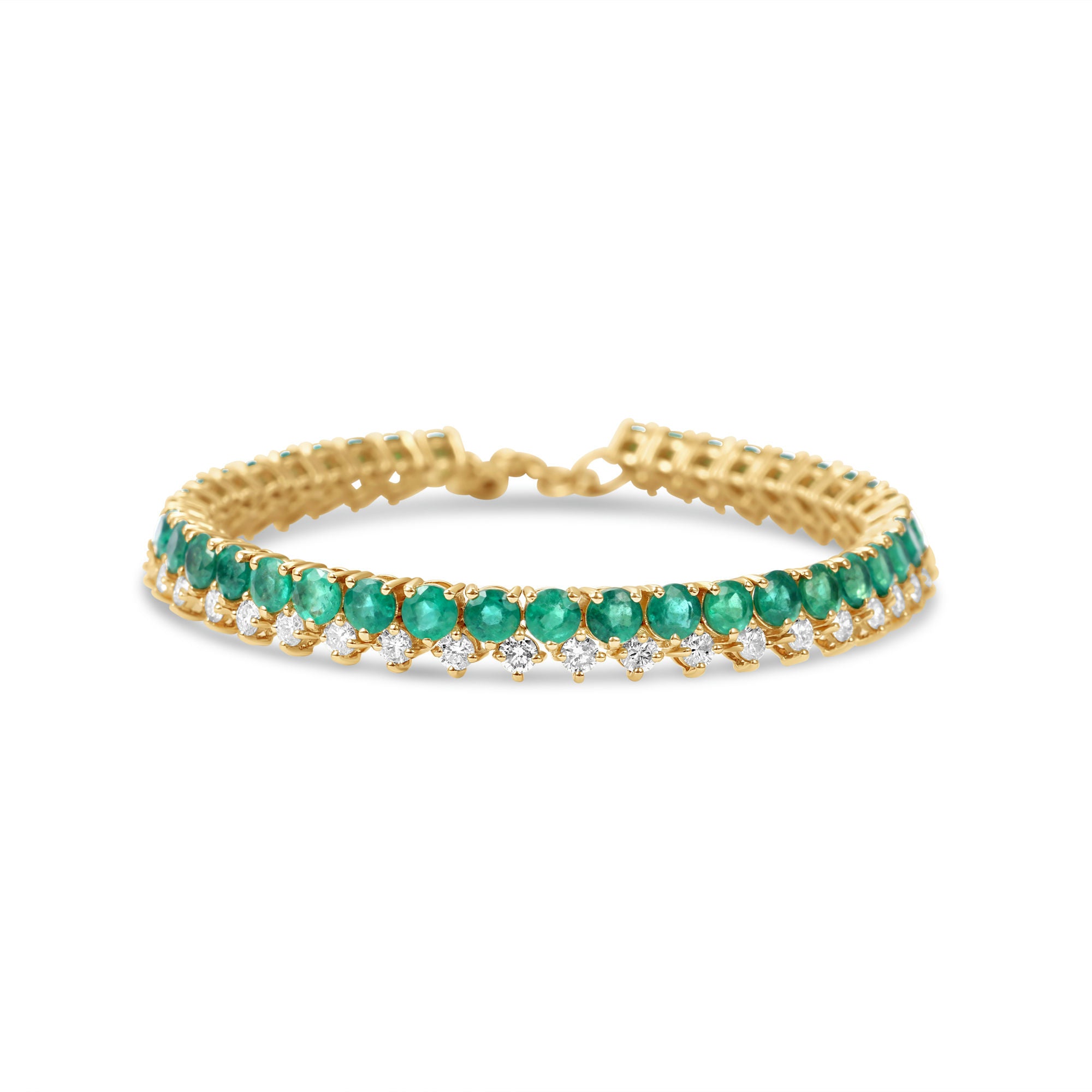 Timeless 14K yellow gold line bracelet featuring vibrant emeralds and radiant diamonds, offering a bold yet sophisticated design with an adjustable fit for versatile wear.
