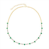 Adjustable 14K yellow gold tennis necklace featuring 2.13ct of pear-shaped emeralds and 4.51ct of G-H VS diamonds, with an 18-inch maximum length and total weight of 17.38g. A bold and vibrant take on the classic tennis necklace.