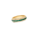 Sleek 14K yellow gold spinning fidget ring featuring vibrant emeralds and radiant diamonds, blending functional stress relief with timeless elegance and sophistication. Tilted Angle