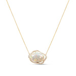 A captivating Ethiopian Welo opal necklace, adorned with a delicate cloud-like halo of sparkling diamonds, crafted in luminous 14K yellow gold—a perfect blend of timeless elegance and exquisite craftsmanship.