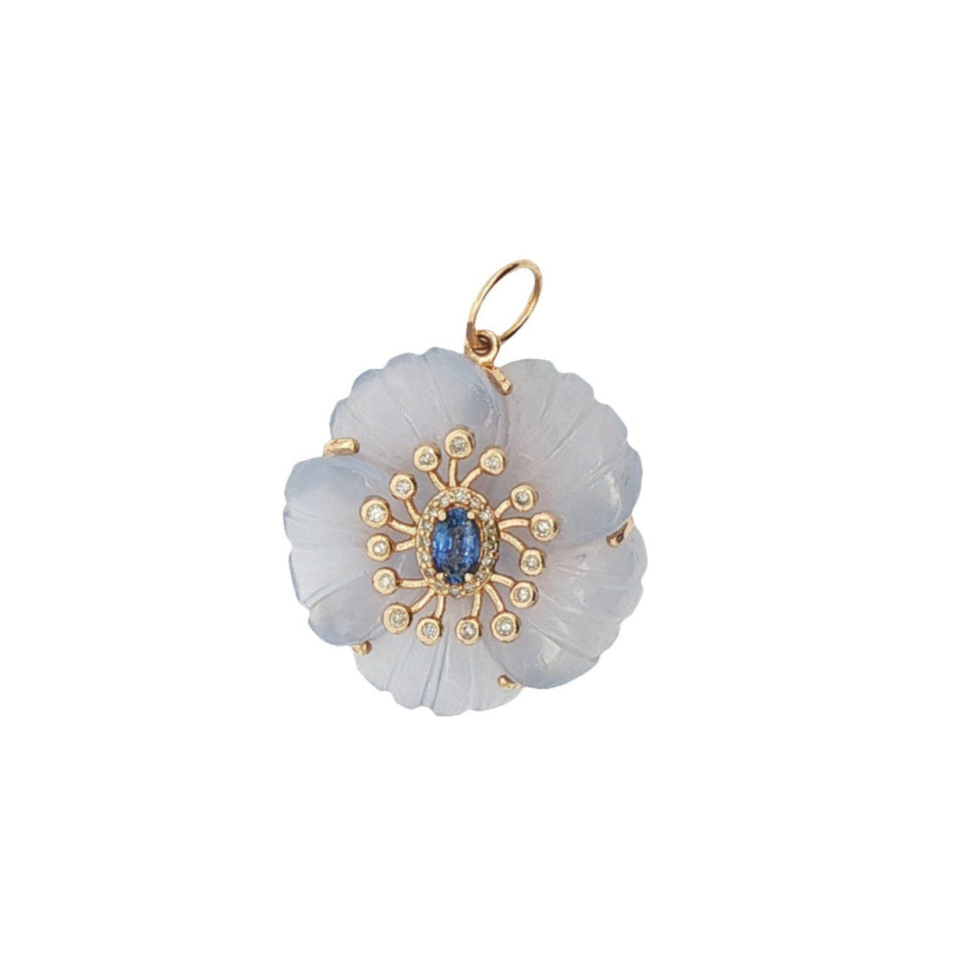 The Fleur de Charme Pendant reimagines the classic floral motif with bold color and architectural precision. Featuring a central gemstone framed by six sculpted, petal-shaped stones, this signature silhouette is crafted in solid 14K gold. Designed to lie flat when worn, the pendant offers subtle dimension and a refined presence—perfect for layering or wearing on its own.

Metal: 14K Solid Gold
Design: Center stone with six precision-cut gemstone petals
Thoughtfully weighted to lay flat against the skin 