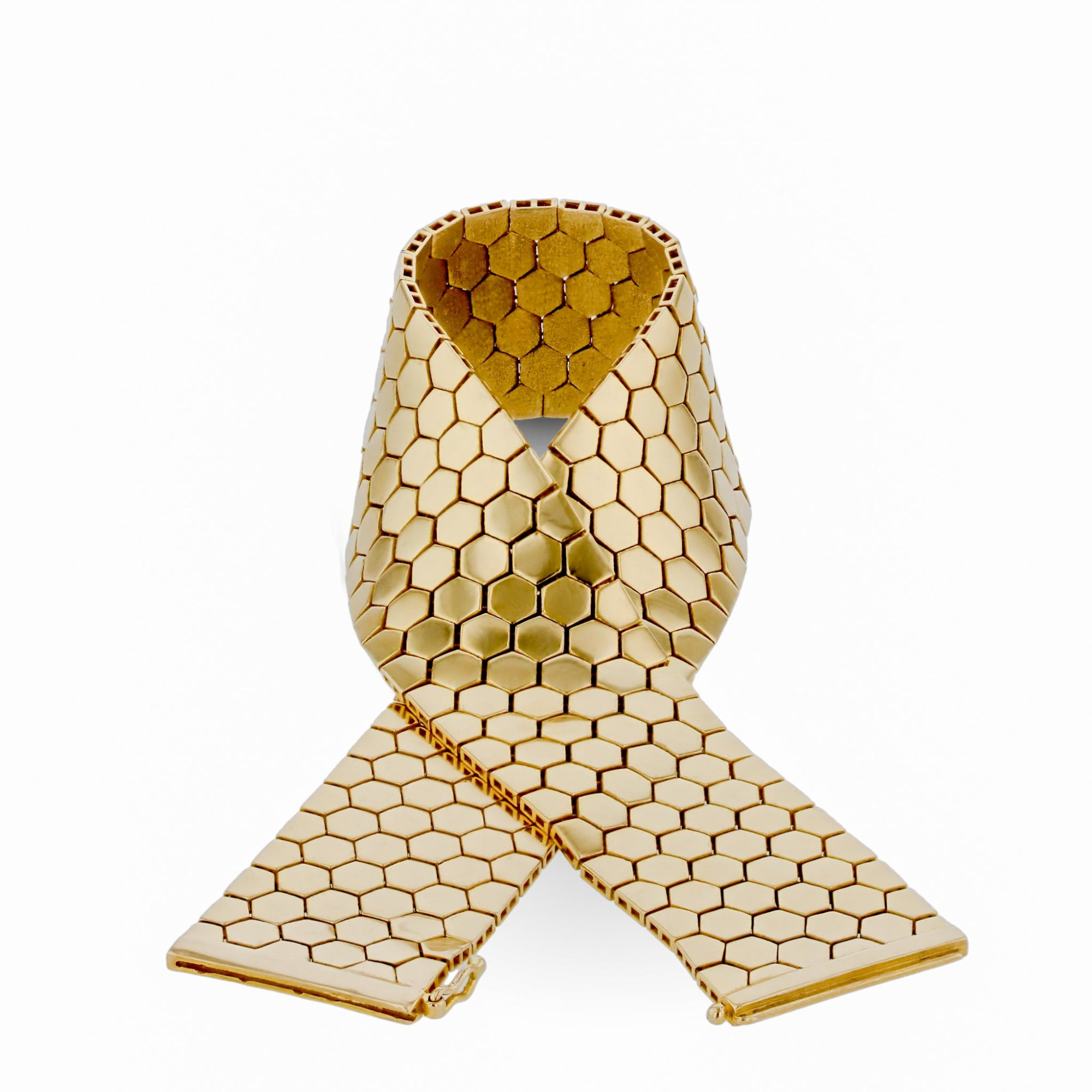 Elegant 14K yellow gold flexible reversible bracelet featuring a dual-sided honeycomb design with matte and shiny finishes, secured with an innovative invisible side slide clasp for effortless style. Close up detail.