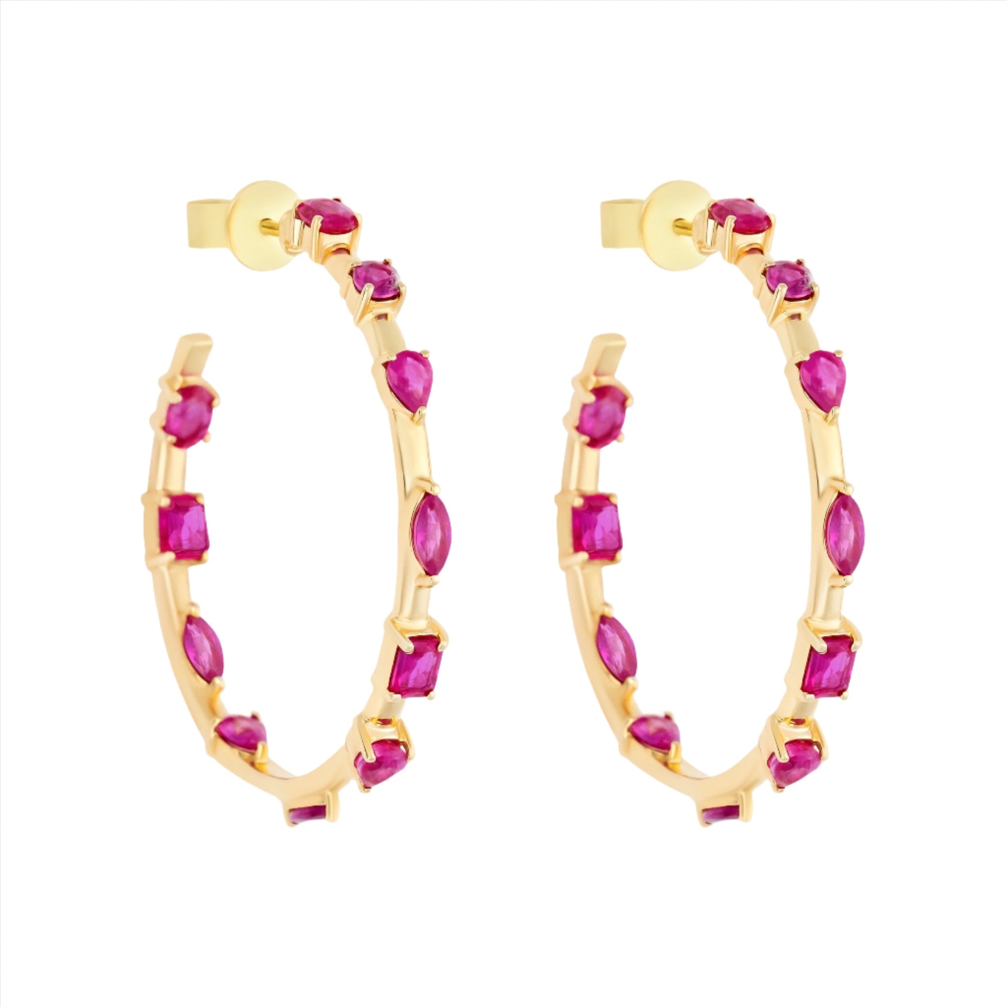 Striking 14K yellow gold hoop earrings featuring an inside-out design with 3.21ct of floating mixed-shape rubies, measuring 42.9mm in diameter for a bold and luxurious statement.
