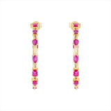 Striking 14K yellow gold hoop earrings featuring an inside-out design with 3.21ct of floating mixed-shape rubies, measuring 42.9mm in diameter for a bold and luxurious statement.