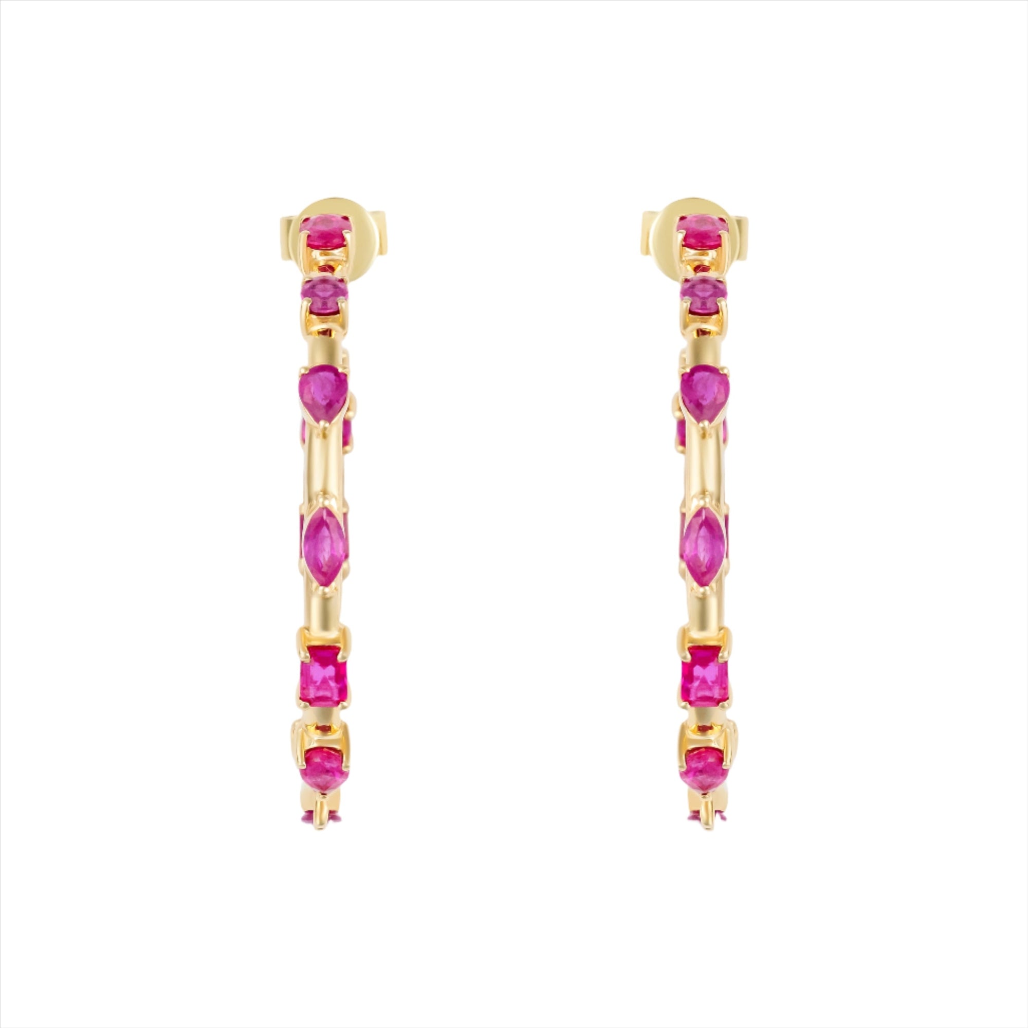 Striking 14K yellow gold hoop earrings featuring an inside-out design with 3.21ct of floating mixed-shape rubies, measuring 42.9mm in diameter for a bold and luxurious statement.