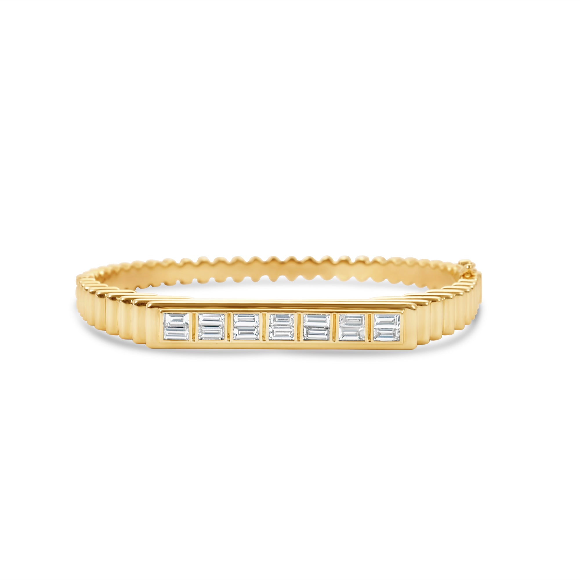 Elegant 14K yellow gold fluted bangle featuring bezel-set baguette diamonds, offering a sophisticated sparkle and timeless design that complements any occasion.