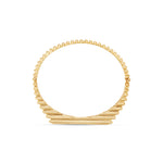 Elegant 14K yellow gold fluted bangle featuring bezel-set baguette diamonds, offering a sophisticated sparkle and timeless design that complements any occasion.