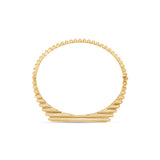 Timeless 14K yellow gold fluted bangle featuring vibrant bezel-set baguette emeralds, offering a refined design that adds a touch of elegance and color to any ensemble. Top Down View