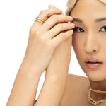 Stunning 14K yellow gold fluted wrap ring featuring pear-shaped pavé illusion diamonds, creating a dazzling effect with intricate texture and elegant craftsmanship, perfect for special occasions or everyday wear. 