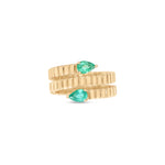 Elegant 14K yellow gold fluted wrap ring featuring two pear-shaped emeralds, blending textured gold craftsmanship with timeless sophistication for a modern yet classic statement piece. Close up. 