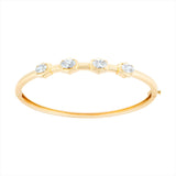14K yellow gold hinge bangle bracelet featuring four G-H VS oval diamonds totaling 3.59ct. With a 6.5-inch inner circumference and a total weight of 11.15g, this modern diamond bangle is feminine, sleek, and timeless.