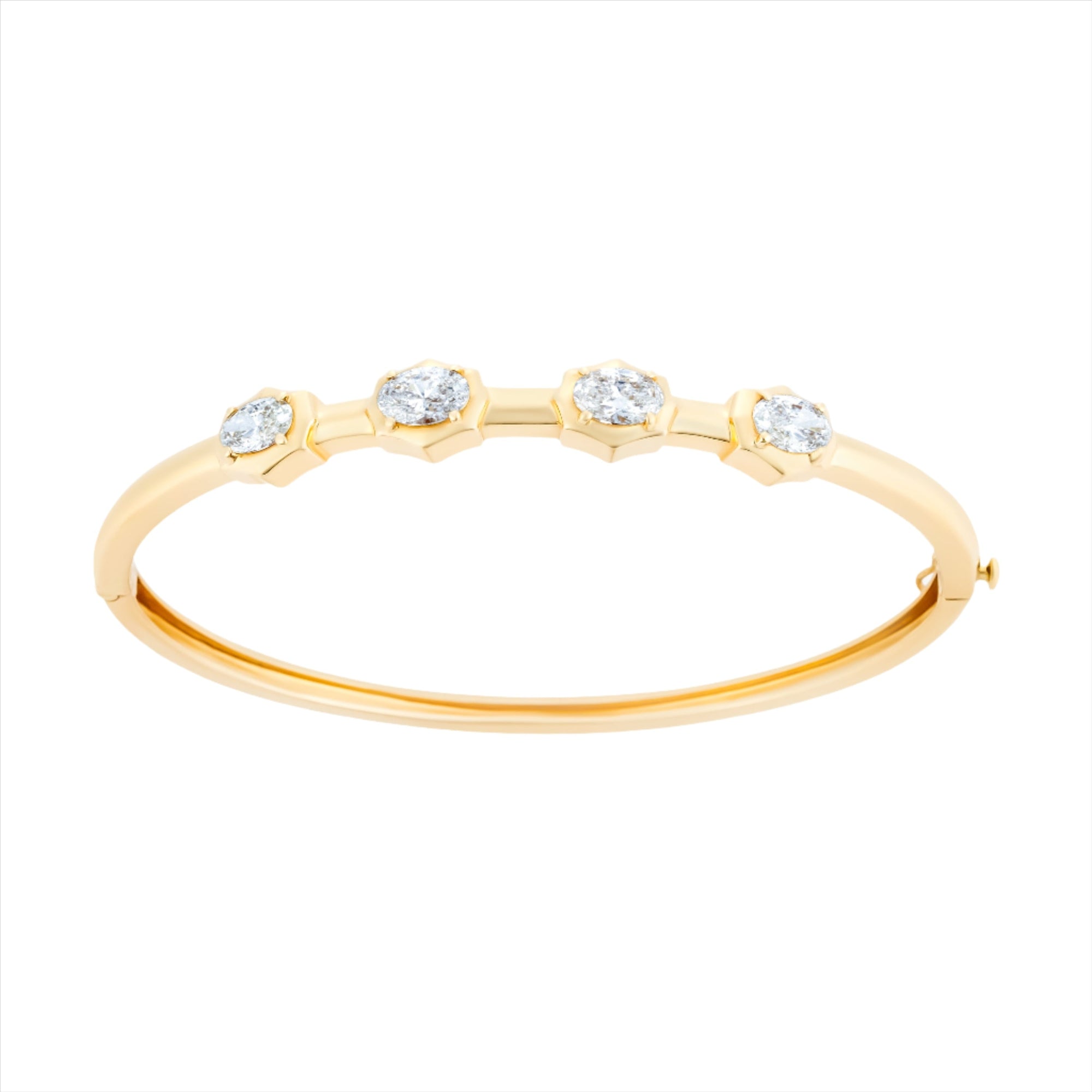 14K yellow gold hinge bangle bracelet featuring four G-H VS oval diamonds totaling 3.59ct. With a 6.5-inch inner circumference and a total weight of 11.15g, this modern diamond bangle is feminine, sleek, and timeless.