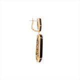 Striking geometric earrings crafted in 14K yellow gold with bold black onyx and sparkling diamond accents, totaling 29.43g—an elegant fusion of modern design and fine materials.