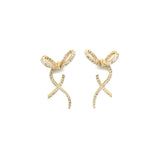 Charming 14K yellow gold bow stud earrings adorned with sparkling diamonds, offering a whimsical yet elegant touch to elevate any outfit. Front detail. 