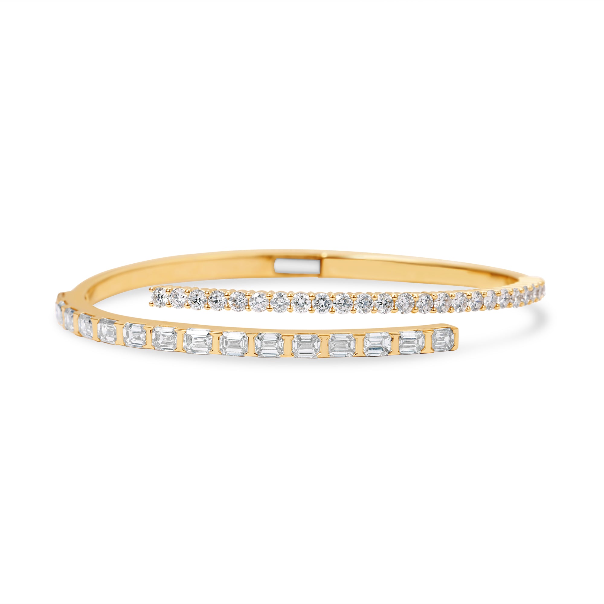 Stunning 14K yellow gold bypass bangle featuring emerald-cut and round-cut diamonds in a seamless design, blending timeless allure with a modern, sophisticated silhouette. Front close up.