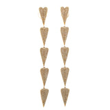 Captivating 14K yellow gold folded heart drop earrings featuring a mesmerizing cascade of pavé-set white diamonds, radiating elegance and sophistication for any occasion. Close up. 