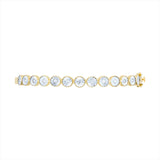 Elegant 14K yellow gold illusion bangle featuring 0.50ct of bezel-set diamonds. Total weight: 10.21g—sleek, modern, and perfect for stacking or wearing solo.