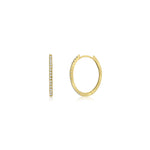 Elegant 14K yellow gold small oval hoop earrings adorned with sparkling diamonds, offering a timeless design perfect for both casual and formal occasions.