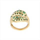 Beautiful 14K yellow gold knot ring featuring a vibrant spray of Zambian emeralds totaling 0.98ct, offering a luxurious and modern twist on a timeless design.