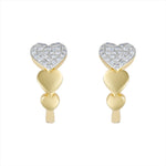 Charming 14K yellow gold heart-shaped huggie earrings featuring a bold pavé diamond heart centerpiece and a graceful graduated design. Compact at 0.50 inches, perfect for everyday sparkle with a romantic twist.