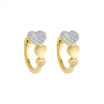 Charming 14K yellow gold heart-shaped huggie earrings featuring a bold pavé diamond heart centerpiece and a graceful graduated design. Compact at 0.50 inches, perfect for everyday sparkle with a romantic twist.